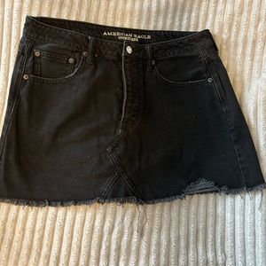 Size 12 American Eagle black denim skirt. Distressed mini skirt.